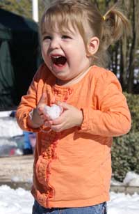 little girl with snowball