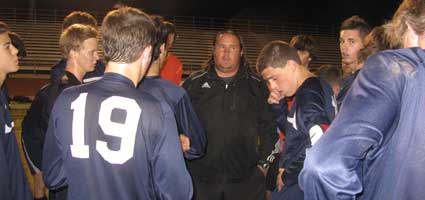 boys soccer team and coach vos