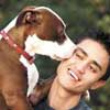 dog hugging man